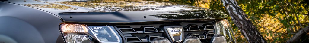 Black solid-coloured bonnet guard from CappaFe in ABS plastic mounted on a brown vehicle